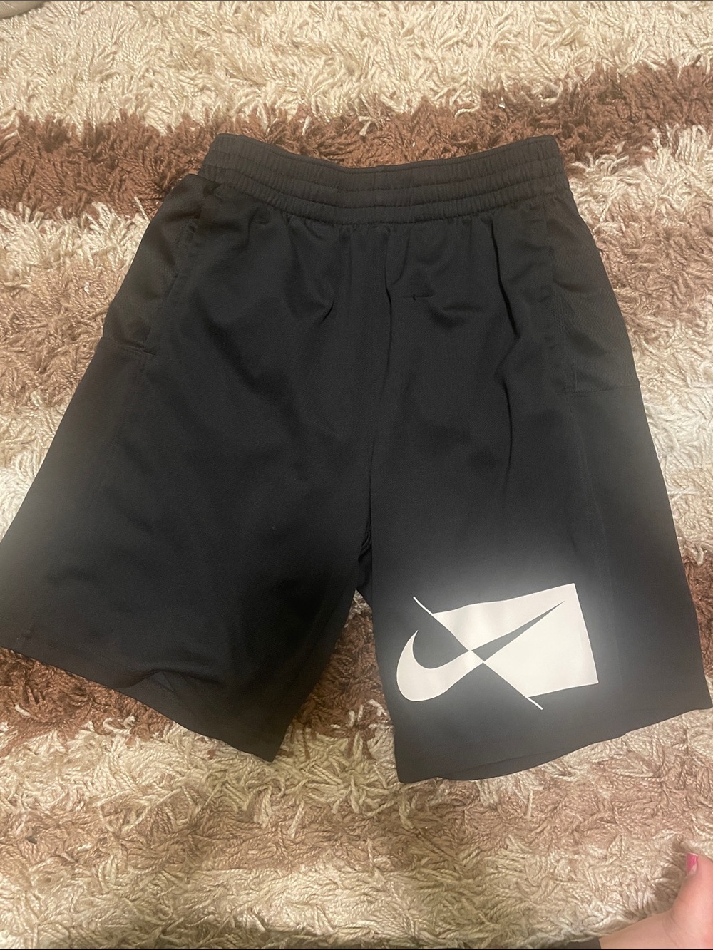 Nike Black Shorts with White Swoosh Graphic